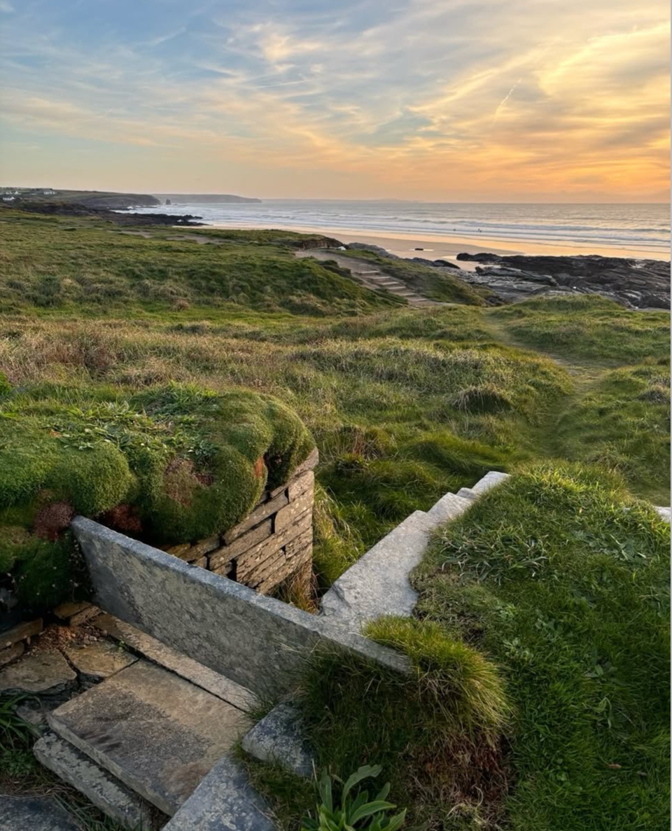 Aerial view of Westwinds beside Constantine Bay's wide sandy beach